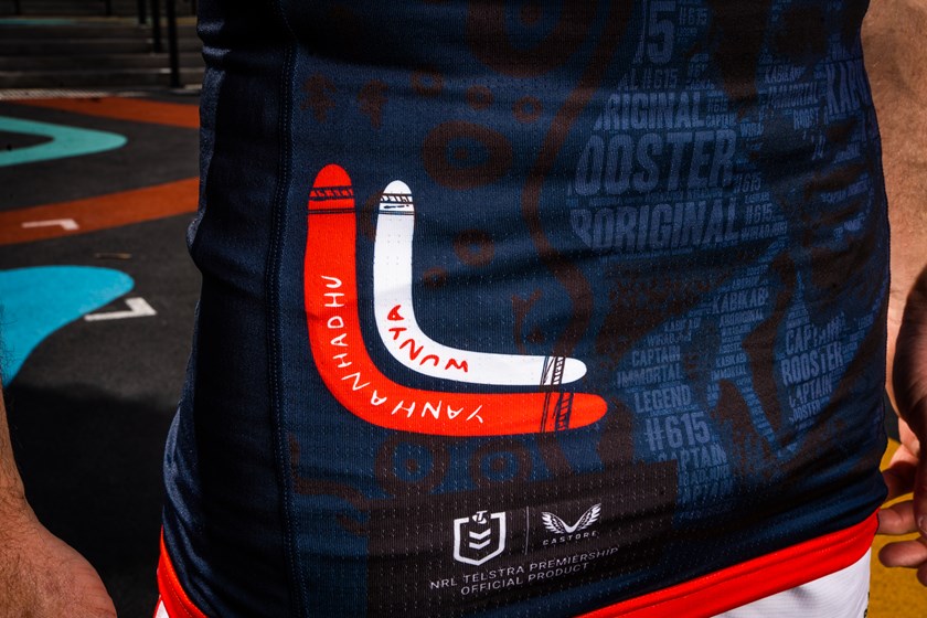 The bottom left corner of the jersey features boomerangs with the words hello and goodbye in Kabi Kabi and Wiradjuri language alongside the symbol of a dolphin.