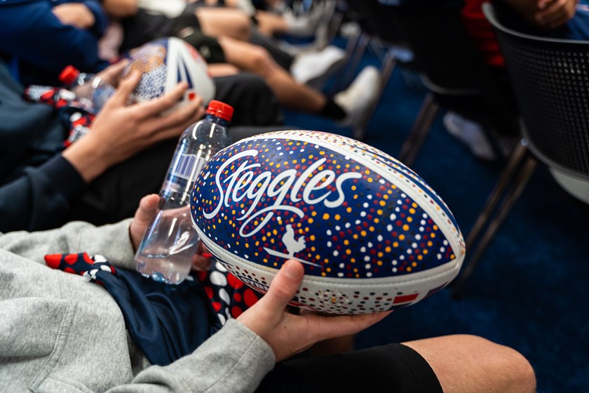 Deadly Designs: Students presented the playing squad with footballs they designed themselves, using dot painting patterns in celebration of Indigenous Round and Reconciliation Week.