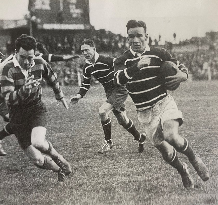 Runaway: Fleet-footed centre Jack Lynch gets away in a match against University during the 1936 season.
